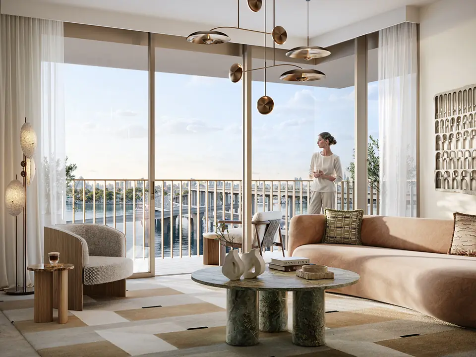 Address Residences — living room opening onto a Creek-view balcony, render (Emaar)