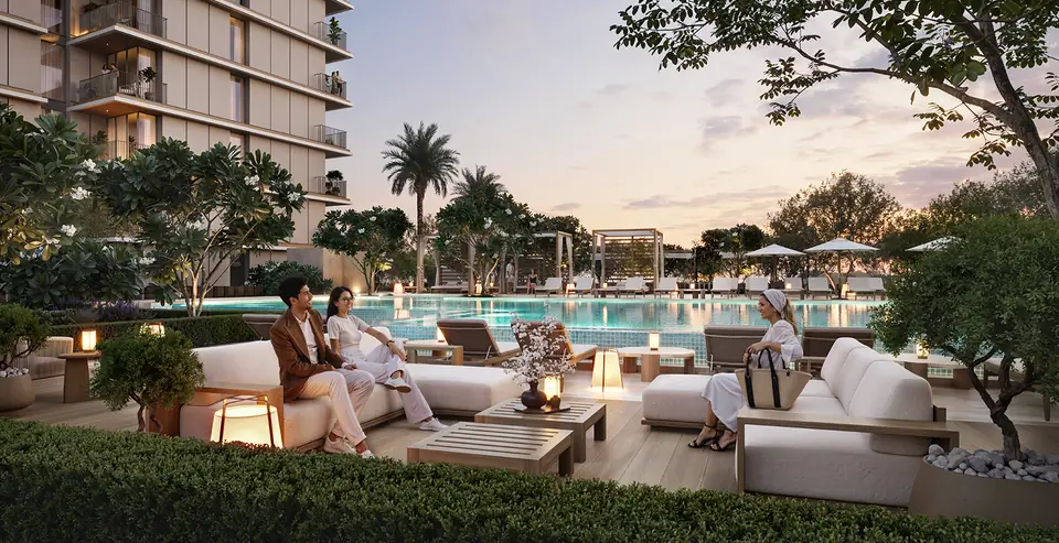 Creek Haven — pool deck lounge at dusk, render (Emaar)